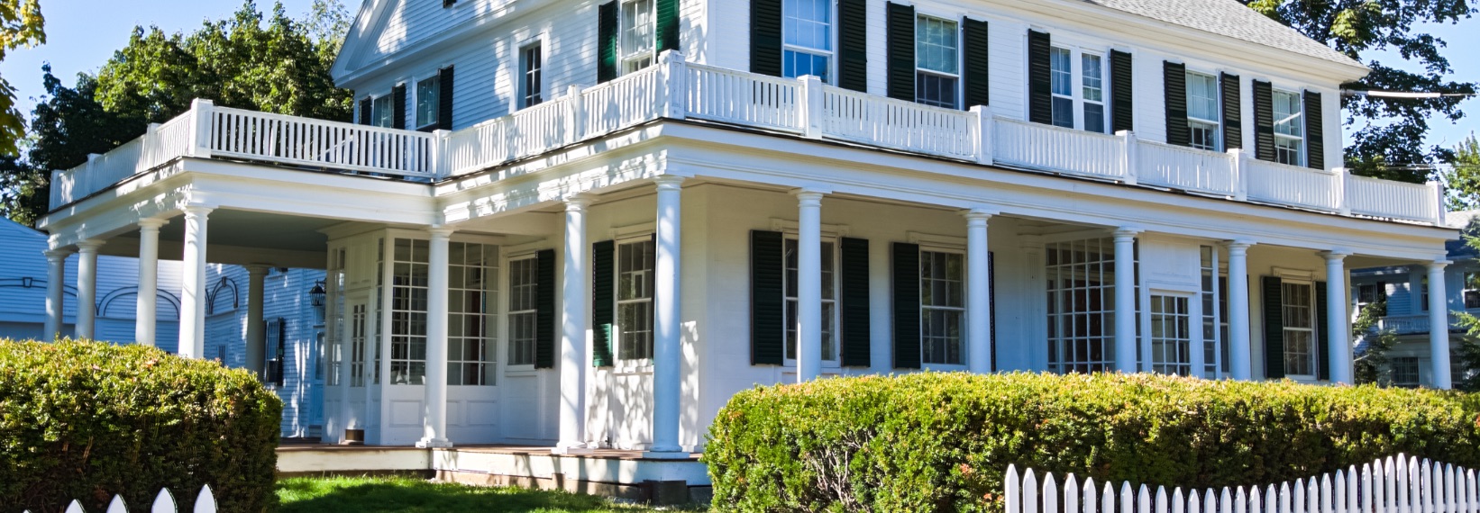large white house with green shutters in the North Shore of Boston 