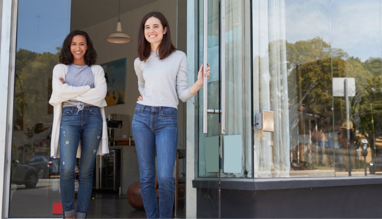 Two women standing in Boston shop doorway 